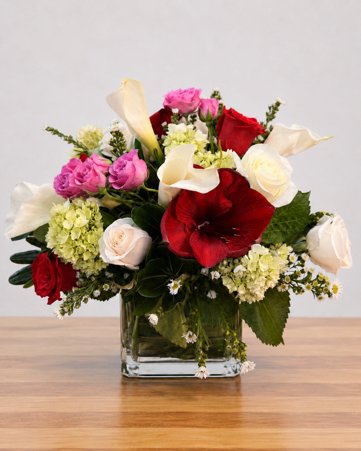 Scarlet Opulence floral arrangement by Pardes Floral